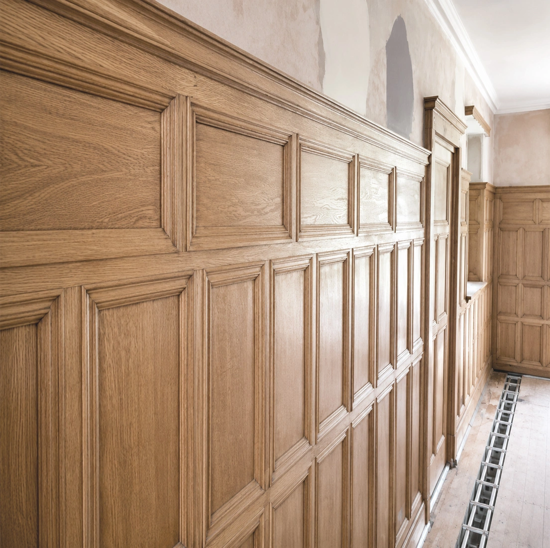 Original oak wall panelling stripped, restored and finished with wax